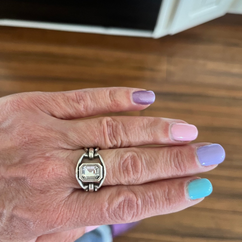 costume ring- silver finish with clear stone adjustable size
